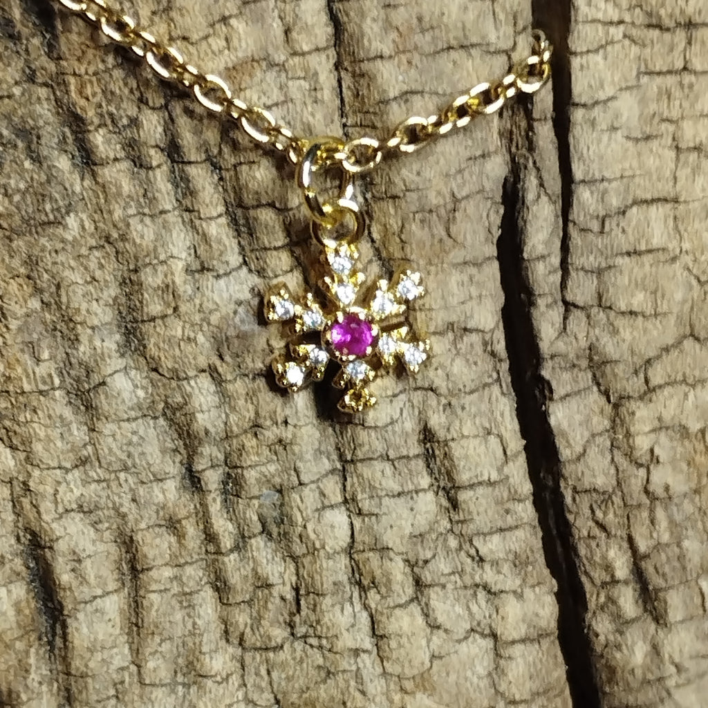 Collier flocon de neige doré strass avec cristal rose fuchsia